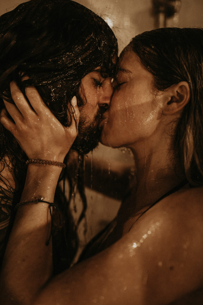 couple kissing under shower